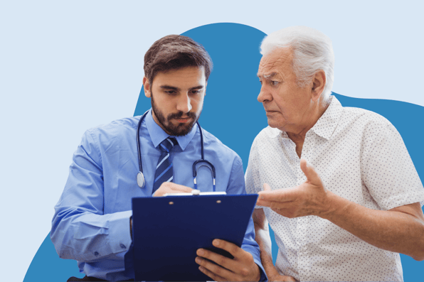 A young male doctor with a stethoscope discusses medical information on a clipboard with an older male patient, representing patient care and communication in healthcare.