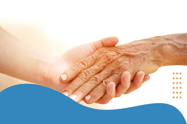 Close-up of a younger hand gently holding the hand of an elderly person, symbolizing care, support, and compassion, with abstract blue and orange graphic elements in the background.